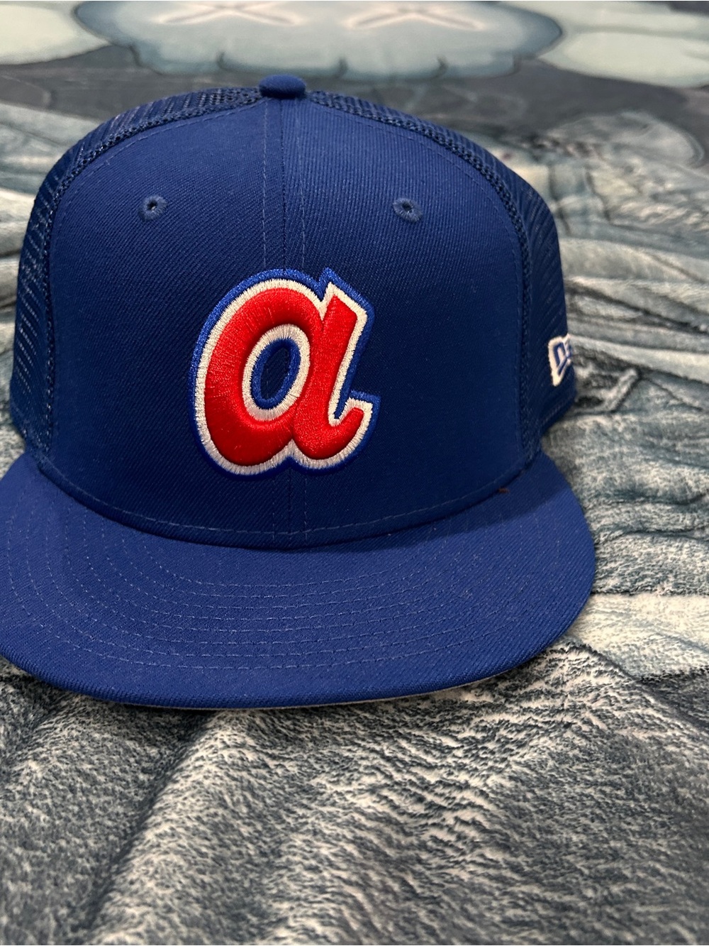 New Era Blue Trucker Hat with Red 'a' Patch